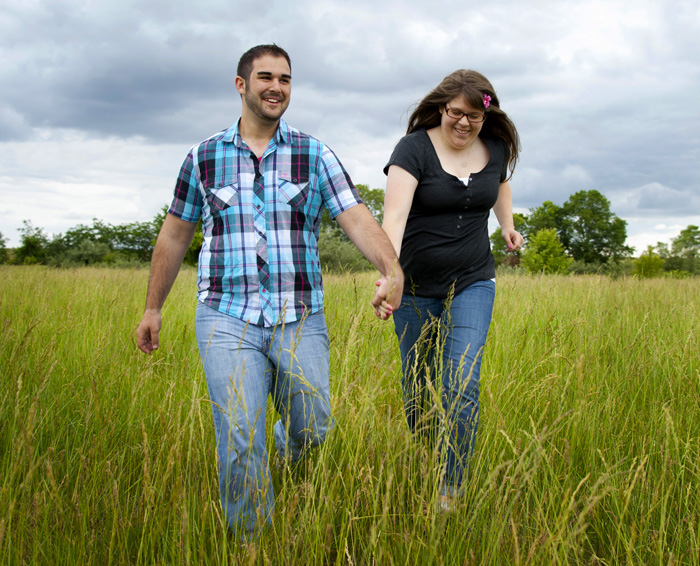 couple-running-in-field-engagement-photography-central-ohio