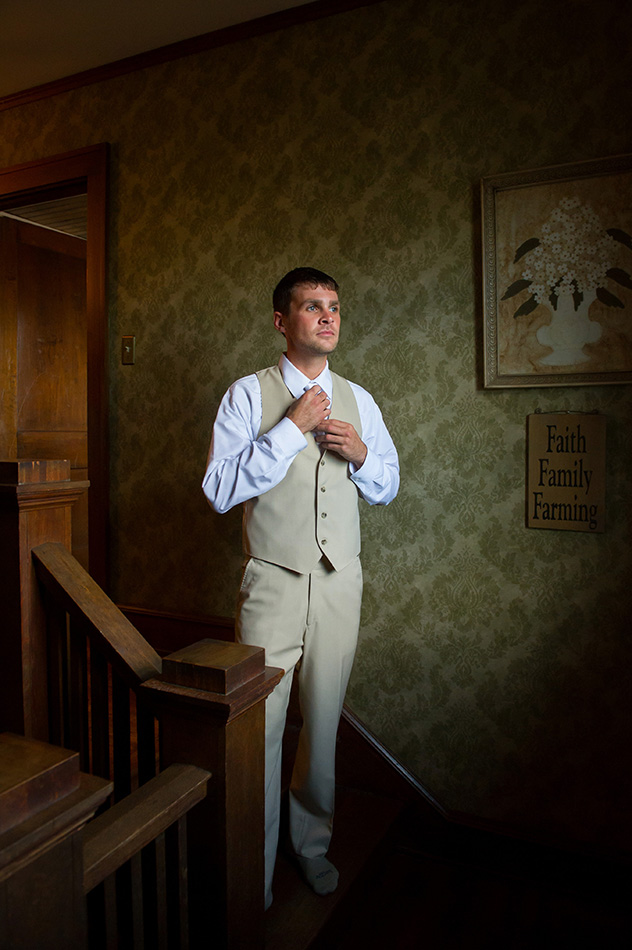 groom-before-wedding-adjusting-tie-bly-photography