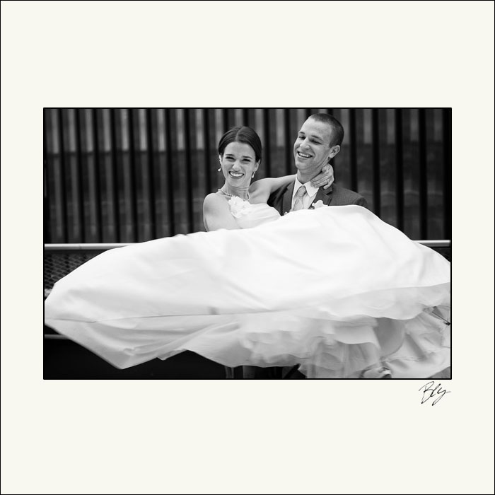 groom-carrying-bride-renaissance-hotel-columbus-bly-photography
