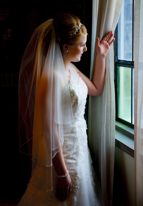 bride-looking-out-of-window-st-marks-bly-photography-columbus-photographer