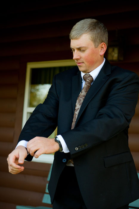 groom-fixing-cuffs-ohio-cabin-wedding