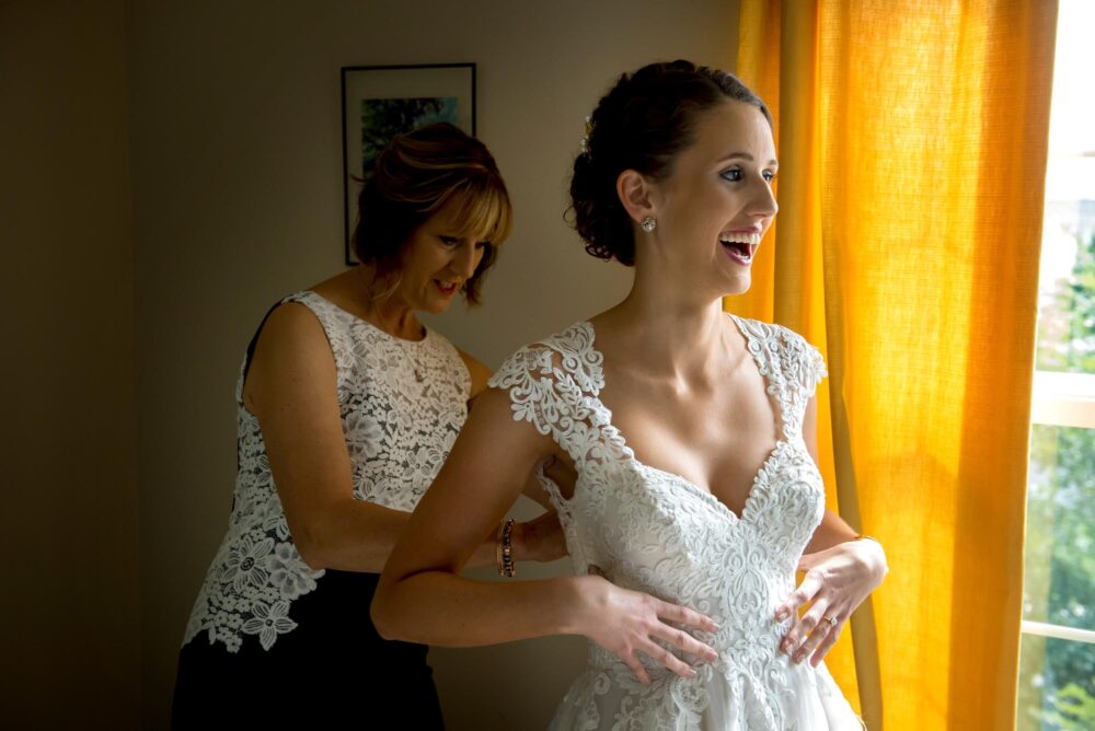 bride getting ready laughing bly photography