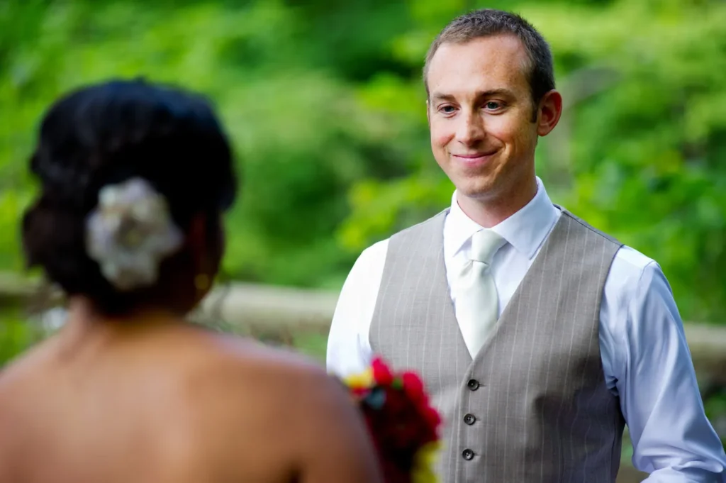 groom smiling at bride